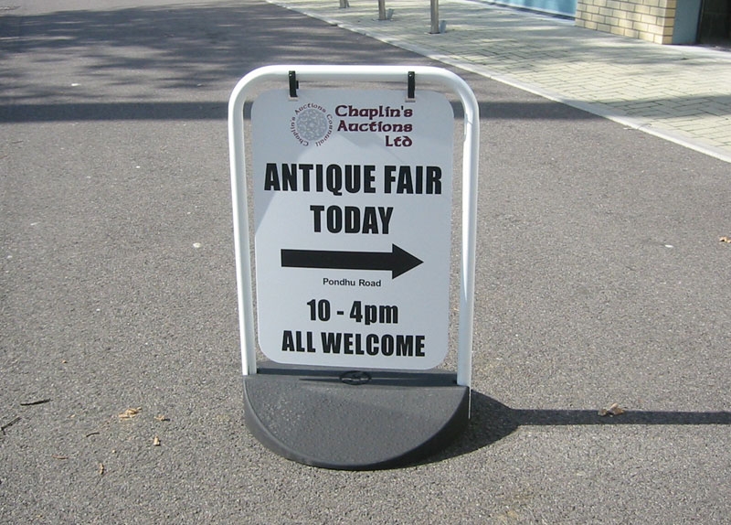 antiques fair direction pavement sign board